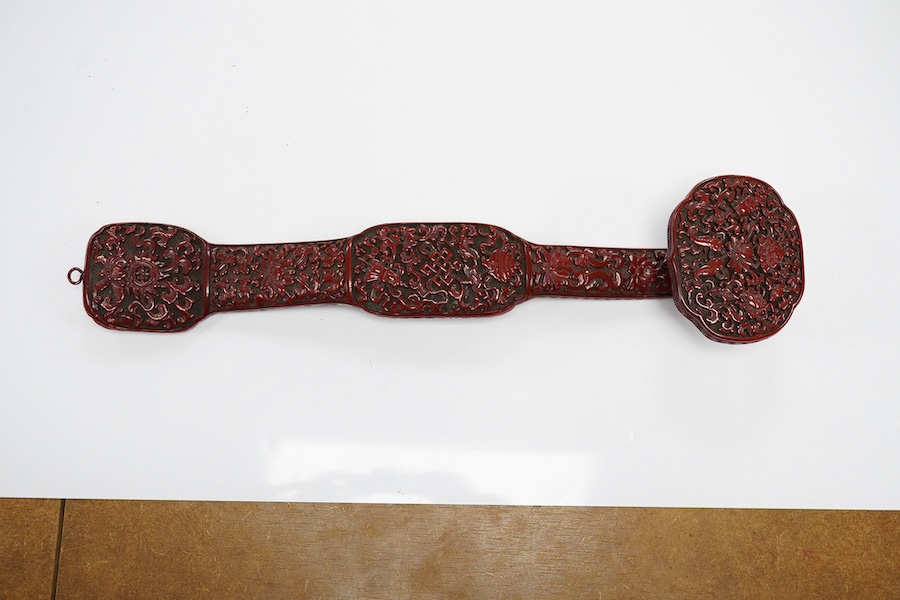 A Chinese red lacquered Ruyi sceptre, 41cm. Condition - fair to good